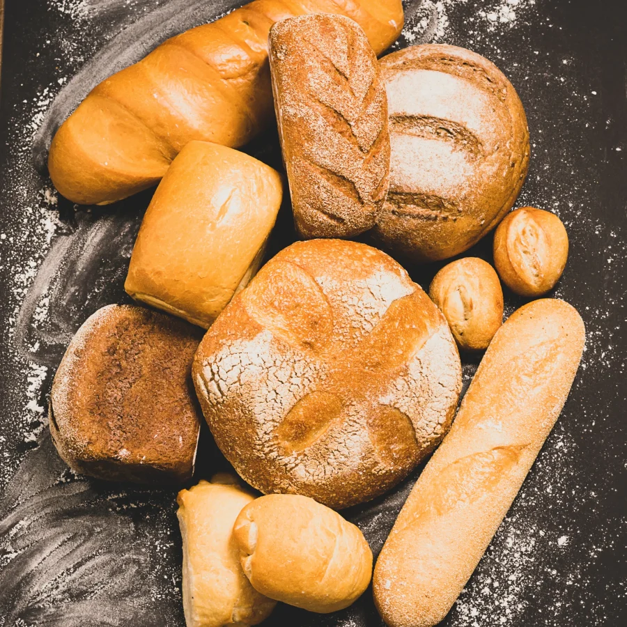 fresh-baked-bread-loaf-buns-white-rye-on-a-rust-2025-01-07-22-18-10-utc
